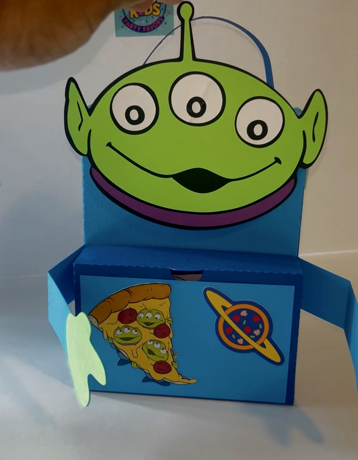 A handmade blue alien activity box, opened to show the pieces inside